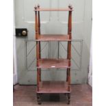 A Victorian rosewood four tier whatnot of simple form with turned mouldings, 42 cm wide x 115 cm