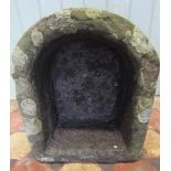 A small weathered natural stone D shaped trough, 45 cm long x 38 cm wide x 22 cm high