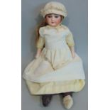 French shoulder head bisque doll by Laternier with soft stuffed body and legs, and bisque lower