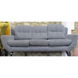 A contemporary but retro style Parker Knoll three piece suite comprising three seat sofa and a