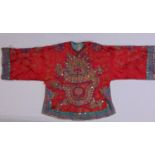 Early 20th century Chinese red silk robe, elaborately embroidered with goldwork featuring a dragon