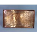 An Arts & Crafts copper tray of rectangular form with Celtic knot design (unmarked), 53 cm x 30 cm