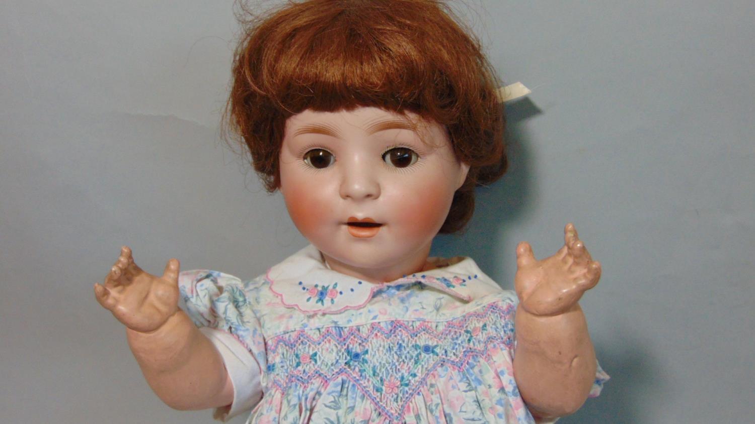 Schoenau & Hoffmeister bisque head baby doll with brown closing eyes, open mouth with teeth, brown - Image 2 of 4