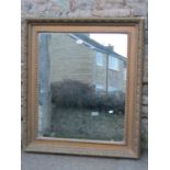 A 19th century gilt frame of rectangular form with foliate and further detail, enclosing a mirror