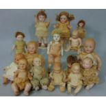 A collection of small jointed dolls, mostly bisque character dolls including one by Kestner, a Bye-