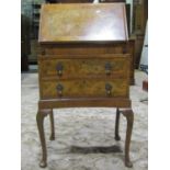 A small, reproduction Queen Anne style, walnut veneered ladies writing bureau, the fall flap