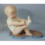 A rare 1950's advertising doll for 'Cherubs for Children', with a chubby ceramic cherub tugging