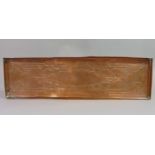An Arts & Crafts copper tray of rectangular form with raised folded rim and foliage detail, 56 cm