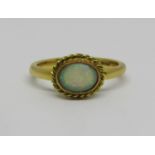 18ct opal ring with rope twist border, size N/O, 4g