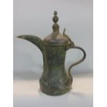 Early Eastern possibly Persian copper ewer with typical pointed spout and baluster form 37 cm high