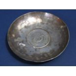 A Chinese silver coin dish inset with a Szechuan Provence seven mace and two canderins coin, 10 cm