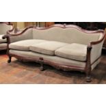 A good quality late 19th century walnut framed drawing room suite comprising a three seat sofa and