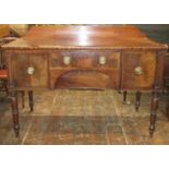 A Georgian mahogany sideboard, the central drawer fitted as a cellarette flanked by two cupboards