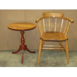 A light elm and beechwood smokers bow type chair with simple turned spindle back over a saddle