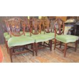 A set of ten good quality reproduction Hepplewhite style shield back dining chairs with carved and
