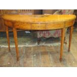 A good quality Georgian demi-lune side table raised on four square tapered legs with spade feet,