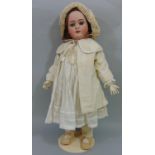 Doll by Simon & Halbig with bisque socket head with jointed pale coloured composition body. weighted