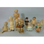 Collection of 8 small all bisque dolls with jointed bodies and side glancing eyes including a pair