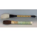 Two Chinese brushes one with a bamboo handle, the other made up of five jade panels, the longest