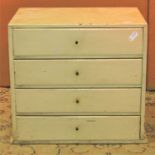 A small vintage painted pine nest of four long drawers, 38 cm wide x 25 cm deep x 33 cm high,