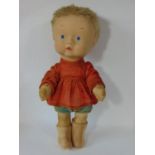 A rare fabric doll by Merrythought 1930's, with large felt covered head, short blonde hair and