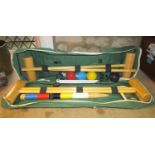 A Jaques London croquet set housed within its original green canvas bag/holdall