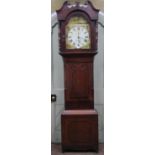 A Regency oak longcase clock, the hood with turned columns and swan necked pediment enclosing a 35