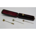 Four antique stick pins to include a diamond set example (4)