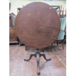 Georgian mahogany snap top table, the circular top 83 cm in diameter, raised on a turned pillar