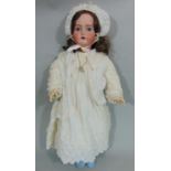 Bisque head doll by Kammer & Rheinhardt with composition jointed body, fixed blue eyes, open mouth