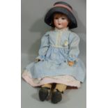 A Schoenau & Hoffmeister bisque socket head doll, with weighted sleeping blue eyes and open mouth