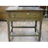 Old English oak side table enclosing a single drawer on turned supports, 77cm wide
