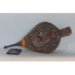 Pair of antique oak fire bellows carved with a coiled fish amidst reeds, with studded leather
