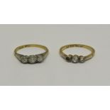 Two 18ct three stone diamond rings, 3.7g total (one af) (2)