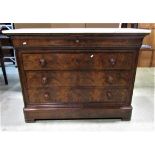 A 19th century mahogany commode of four long drawers with flame veneers beneath a white marble