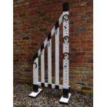 A novel painted freestanding wooden equestrian tack/harness stand, with slatted framework, 82cm high