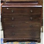 An Edwardian mahogany bedroom chest of four long graduated drawers with embossed ring brass handles,