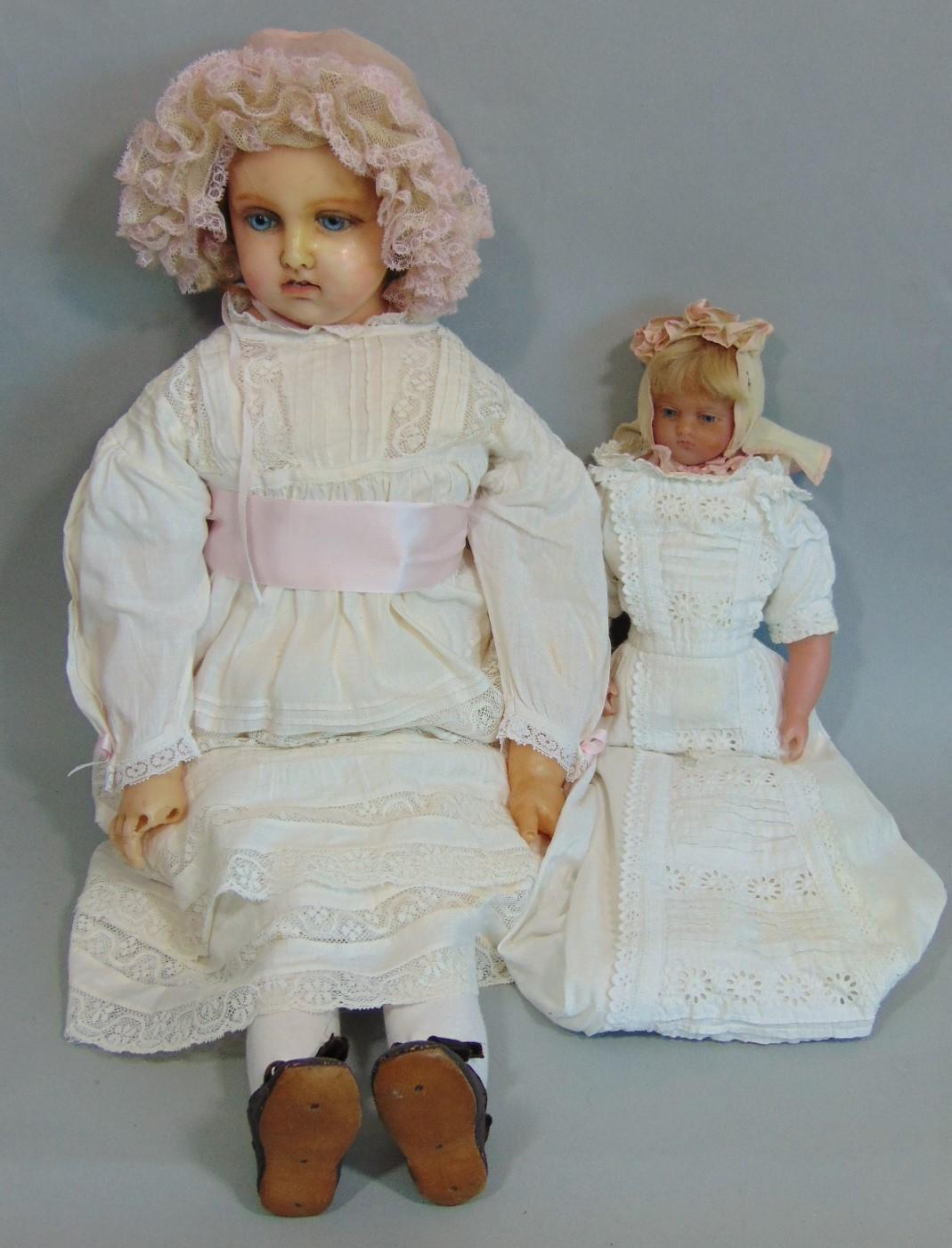 19th century wax over composition shoulder head doll with stuffed soft body and hollow wax lower