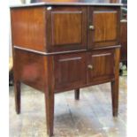 An Edwardian mahogany side cupboard enclosed by two pairs of panelled doors on square cut