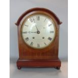 Mahogany twin train lancet mantle clock in boxwood inlaid walnut, the silvered dial inscribed