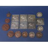 A collection of white metal and other tokens and plaques relating to The British Bulldog and other