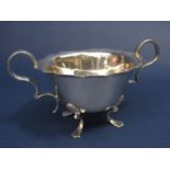 A good quality silver twin handled dish / bowl with S scroll handles and scallop shell backed