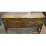 An 18th century elm six plank coffer of simple construction on shaped supports, 122 cm in length x