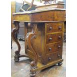 A Victorian figured walnut davenport of usual form with four real and four dummy drawers, cabriole