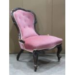 A Victorian ladies spoonback drawing room chair with serpentine upholstered seat and button back