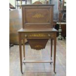 An inlaid Edwardian mahogany ladies work table, raised on four square tapered legs united by central