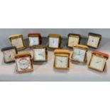A collection of twenty two various leather cased folding travel alarm clocks by HAC, Westclox and