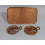 The Birmingham Guild Ltd - pair of small Arts & Crafts copper and brass chamber sticks of circular