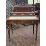 Late 19th century writing desk fitted with three frieze drawers on turned and fluted supports, the