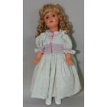 Mid 20th century walking doll, height 70cm, with composition body and closing blue eyes. Head